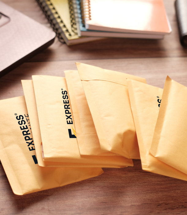 Packages with Express Overnite logo sprawled across desk surface.