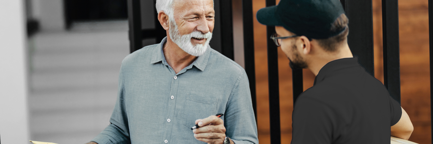 Male signing for a delivered package with delivery drive